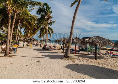 Playa Ancon, Cuba - Feb 9, 2016: Tourists Sunbathe At The Beach Playa Ancon Near Trinidad, Cuba