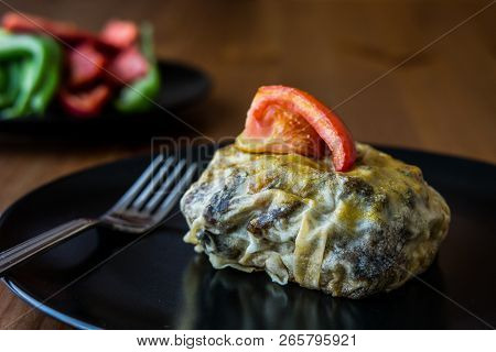 Turkish Bohca Kebab / Crepe With Cubed Meatball And Vegetables.