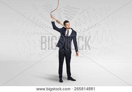 Hopeless young businessman trying to suicide with question signs concept