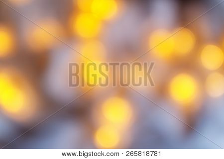 Background From Blurry Light Lights Of Fir-tree Garland On Dark. Copy Space.