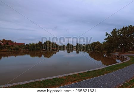 Beautiful Lake During Cloudy Sunrise In Telc. Trees Reflected In The Water. Summer Morning View. The