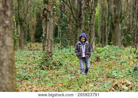 Homeless And Abandoned. Homeless Child Walk In Woods. Homeless Boy Without Parental Care Outdoor. St