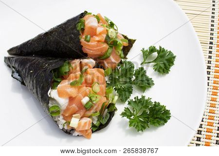 A Close Up Of Salmon Temaki Against A White Background. Sushi Temaki Salmon Isolated On White Backgr