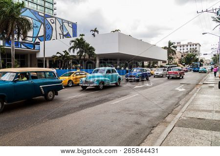 Havana, Cuba - Feb 21, 2016: Vintage Cars In Front Of Hotel Habana Libre Located In The Vedado Neigh