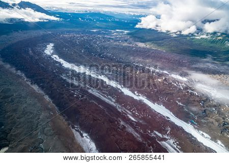 Beautiful Aerial View Of Root Glacier In Wrangell St. Elias National Park With Wispy Clouds In The A