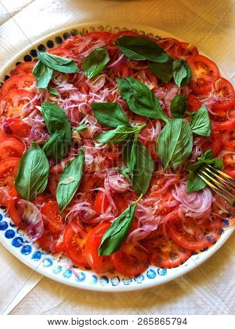 Fresh Tomatoes And Basil Leaves Salad For The Starter