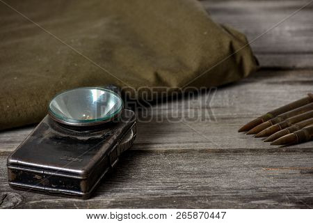 7, 92 X 57 - Rustic Ammos, Poncho And Old Flashlight Lies On The Wooden Background