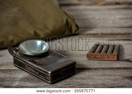 7, 92 X 57 - Rustic Ammos, Poncho And Old Flashlight Lies On The Wooden Background