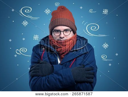 Young hipster frozen boy with doodled snowflakes and windy concept