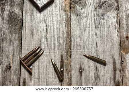 Disassembled Clip With Cartridges 7, 92 X 57 - Rustic Ammos Lies On The Wooden Background