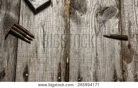 Disassembled Clip With Cartridges 7, 92 X 57 - Rustic Ammos Lies On The Wooden Background