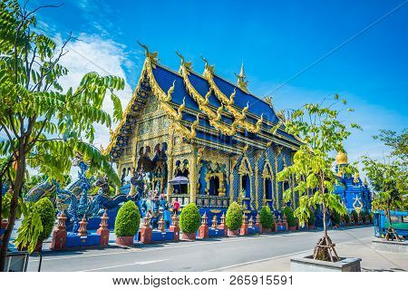 Wat Rong Sua Ten Temple With Blue Sky Background, Chiang Rai Province, Thailand, It's A Popular Dest