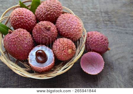 Fresh Organic Lychees In A Basket On Old Wooden Background.exotic Tropical Lichi Fruits.raw Diet Or 