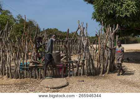 Orango Island, Guinea-bissau - February 3, 2018:  Group Of Boys Drewing Water From A Comminity Well 