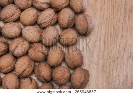 Inshell Walnuts On A Wooden Table. Healthy Food. Healthy Lifestyle.