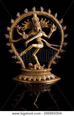 Statue of indian hindu god Shiva Nataraja - Lord of Dance on black background with reflection