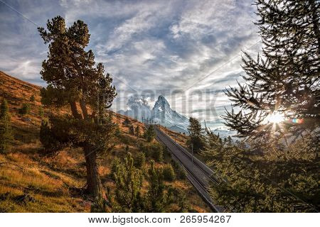 Matterhorn Peak With Railway Against Sunset In Swiss Alps, Switzerland