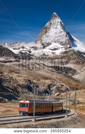 Famous Matterhorn Peak With Gornergrat Train In Zermatt Area, Switzerland