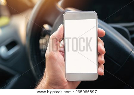 Using Smartphone In Car, Mock Up Blank Screen Of Mobile Phone Device In Hand Of Adult Caucasian Male