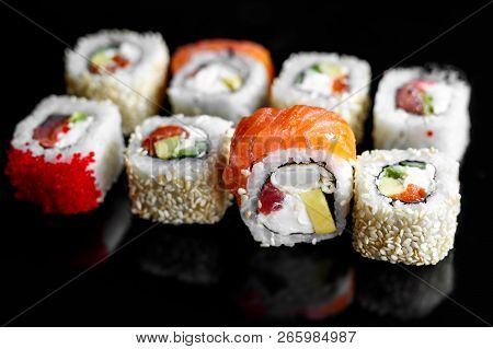 Rainbow Sushi Roll With Salmon, Eel, Tuna, Avocado, Royal Prawn, Cream Cheese Philadelphi. Sushi Men