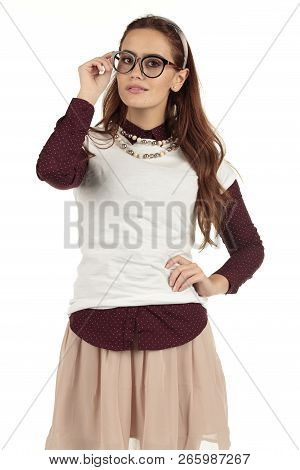 Day Dreaming Preppy Girl Look Into The Distance With A Pink Skirt And White T-shirt