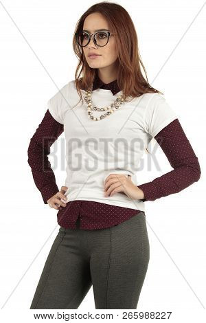 Cute Smiling Preppy, Fashion Geek Girl In A White T-shirt And Maroon Blouse