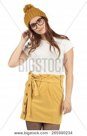 Cute Smiling Preppy, Fashion Geek Girl In A White T-shirt And Yellow Skirt