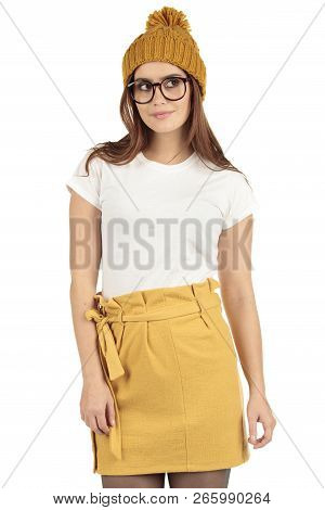 Cute Smiling Preppy, Fashion Geek Girl In A White T-shirt And Yellow Skirt