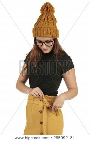 Cute Smiling Preppy, Fashion Geek Girl In A Black T-shirt And Yellow Skirt
