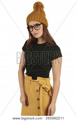 Cute Smiling Preppy, Fashion Geek Girl In A Black T-shirt And Yellow Skirt