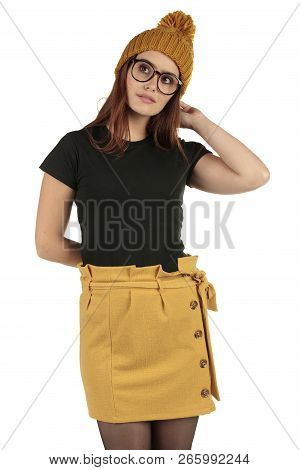 Cute Smiling Preppy, Fashion Geek Girl In A Black T-shirt And Yellow Skirt