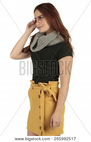 Cute Smiling Preppy, Fashion Geek Girl In A Black T-shirt And Yellow Skirt