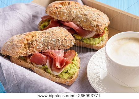 Sandwiches With Ham And Avocade Spread, On Wooden Tray.
