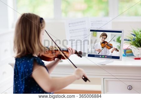 Child Playing Violin. Remote Learning From Home. Arts For Kid. Little Girl With Musical Instrument
