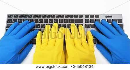 Four Hands In Bright Rubber Gloves Are Typing On The Keyboard.disinfection In Public Places, The Fig