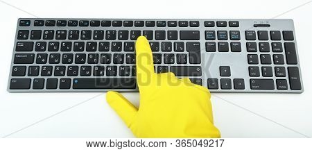 Disinfection In Public Places, The Fight Against The Virus, Coronavirus. A Working Hand In A Rubber 