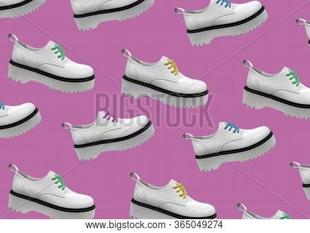 White Leather Platform Shoes Isolated On Pink Background. Classic Shoes On A High Black Tractor Plat
