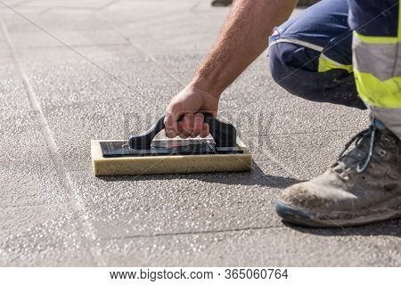 Craftsman Works With Tiler Tools - Close Up Road Worker