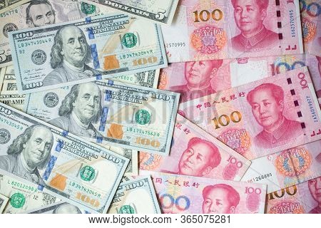 The Many Banknote. Money Hundred Dollars Bills .pile Of Various Currencies Isolated On Yuan Backgrou