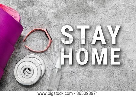 Lilac Yoga Mat, Fitness Tracker Bracelet And Dumbbell Weight On A Gray Textural Background With Copy