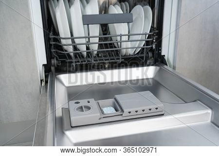 Open Dishwasher With Clean Dishes, Close-up. Dishwasher.