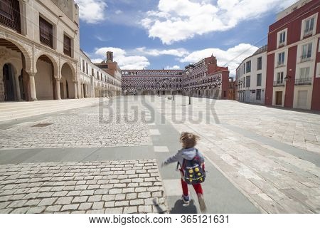 Running Child At Upper Square Of Badajoz, Extremadura, Spain. It Was For Centuries The Center Of The
