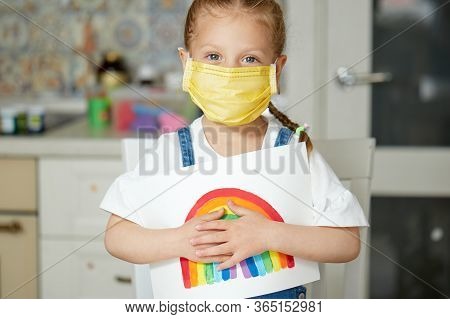 Thank To Nhs. Kid In Protective Mask Painting The Rainbow During Covid-19 Quarantine At Home. Corona