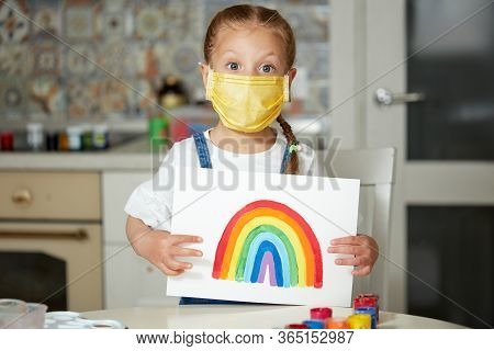 Thank To Nhs. Kid In Protective Mask Painting The Rainbow During Covid-19 Quarantine At Home. Corona