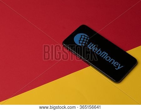 Warsaw, Poland - May, 2020 Web Money Iphone Screen On Colored Background. Web Money Is A Online Paym