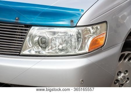 Novosibirsk/ Russia - May 02 2020: Nissan Presage,  Modern Silver Car Xenon Lamp Headlight. Detail L