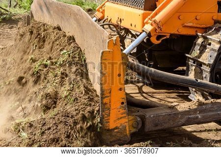 Industrial Building Construction Site Bulldozer Leveling And Moving Soil During Highway Building. Ye