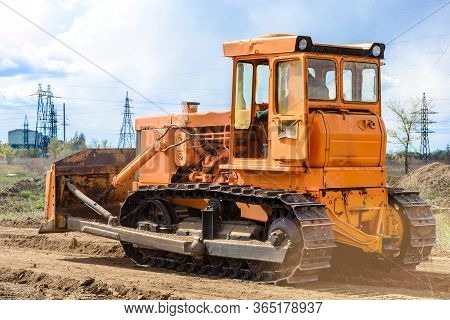 Industrial Building Construction Site Bulldozer Leveling And Moving Soil During Highway Building. Ye
