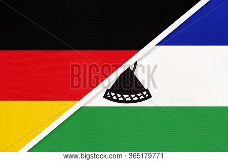 Federal Republic Of Germany Vs Kingdom Of Lesotho, Symbol Of Two National Flags From Textile. Relati
