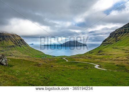 Road Down To The Ocean With Islands In The Background